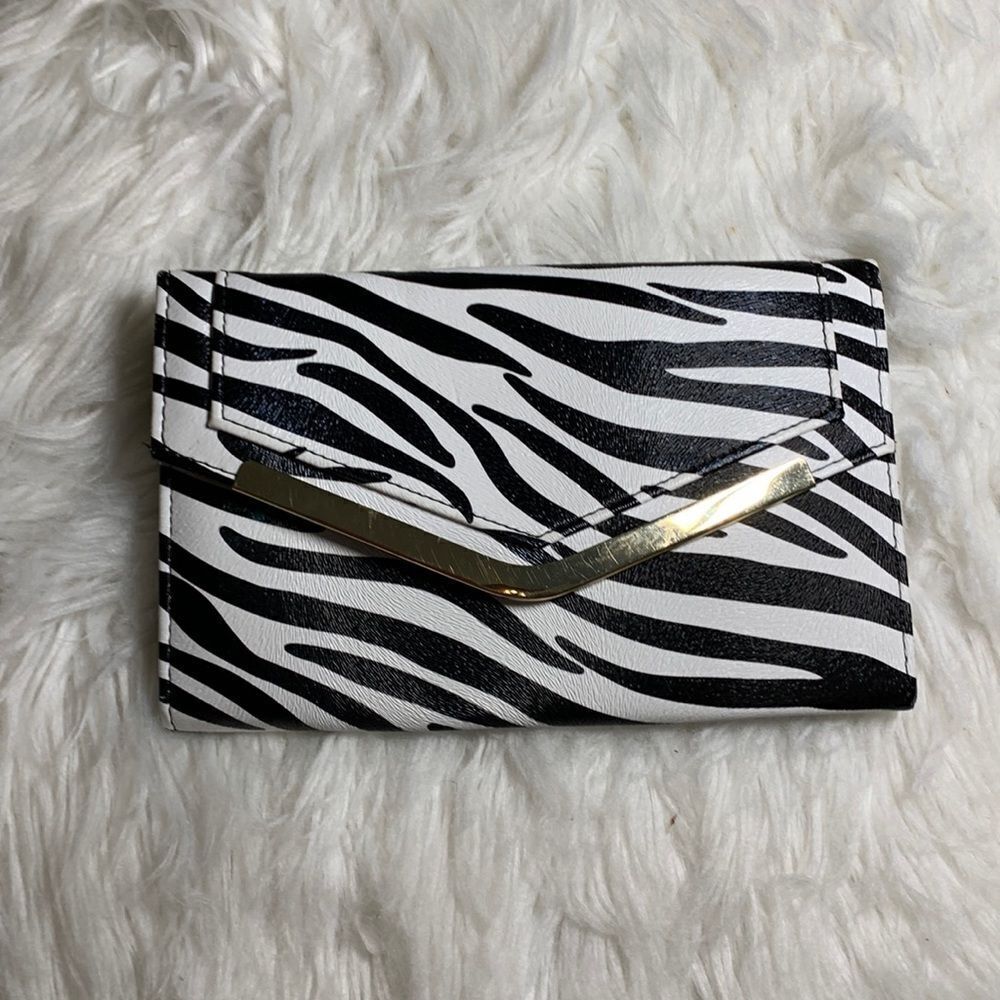 Avenue 9 zebra print clutch.  See photos for complete description/details.